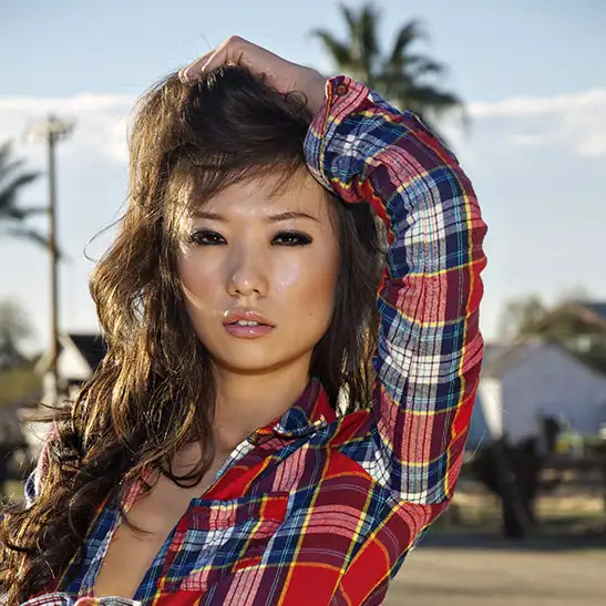 Asia posing in her sexy plaid ourfit