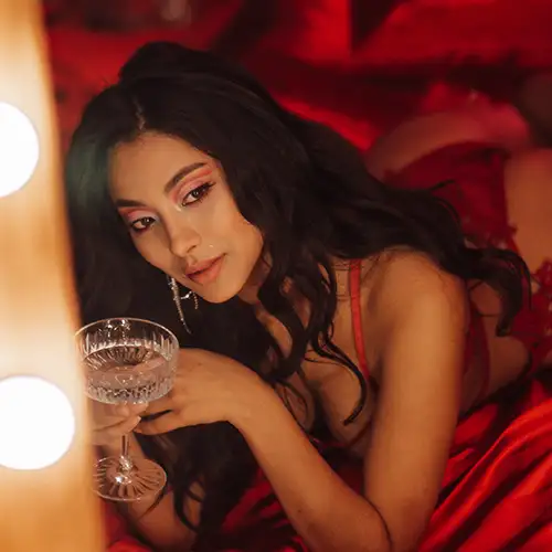 Girl laying on a bed in a brothel