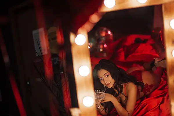 Girl laying on a bed in a brothel